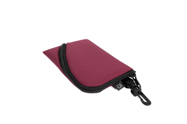 A Mini Ghost Whale Pouch in Raspberry.